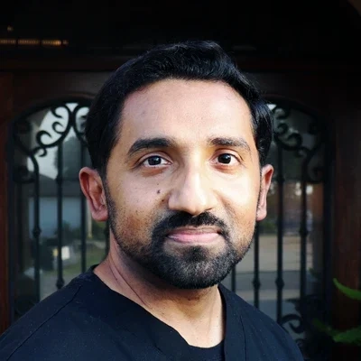 Alex Jolly smiling outside.